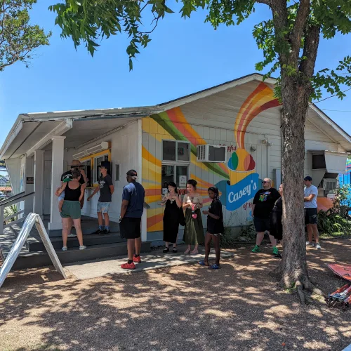 A crowd of customers ordering snowballs at Casey's food truck