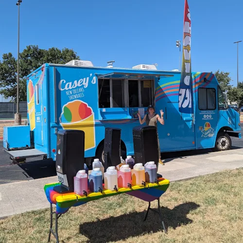 Casey's food truck counter with syrup bottles lined up for a party